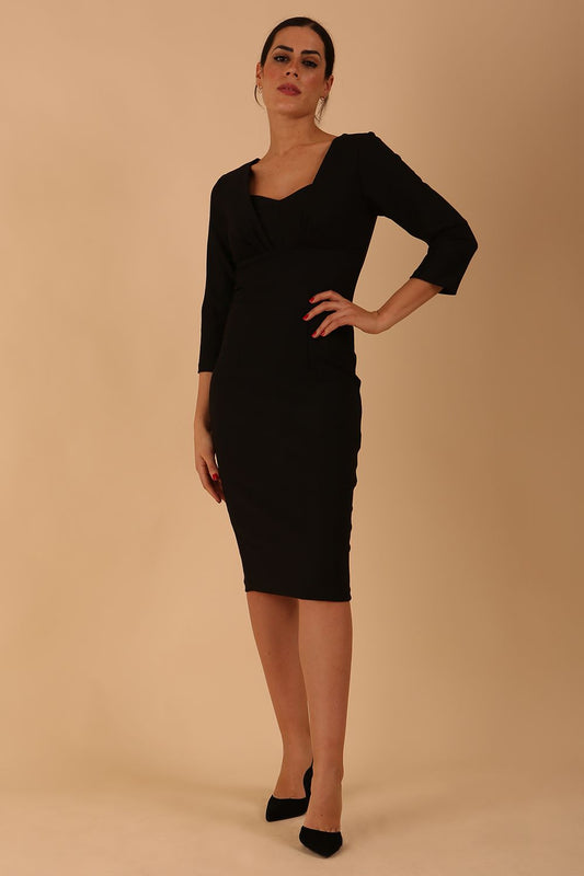 Model wearing the Seed in pencil dress design in black front image