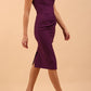 Model is wearing diva catwalk seed bonnie pencil skirt dress with cap sleeves and sweetheart neckline with pleating across the tummy in colour purple front
