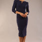 model is wearing a diva catwalk seed fitzrovia 3/4 sleeve pencil dress with round neckline and v-slit and pleating details on the skirt in navy blue front