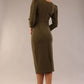 model is wearing a diva catwalk seed fitzrovia 3/4 sleeve pencil dress with round neckline and v-slit and pleating details on the skirt in Olive Green back