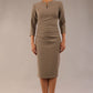 model is wearing a diva catwalk seed fitzrovia 3/4 sleeve pencil dress with round neckline and v-slit and pleating details on the skirt in taupe brown front