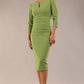 model is wearing A diva catwalk seed fitzrovia 3/4 sleeve pencil dress with round neckline and v-slit and pleating details on the skirt in cirtrus green front