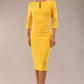 model is wearing a diva catwalk seed fitzrovia 3/4 sleeve pencil dress with round neckline and v-slit and pleating details on the skirt in daffodil yellow front