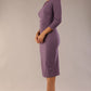 model is wearing a diva catwalk seed fitzrovia 3/4 sleeve pencil dress with round neckline and v-slit and pleating details on the skirt in dusky lilac side front