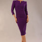 model is wearing a diva catwalk seed fitzrovia 3/4 sleeve pencil dress with round neckline and v-slit and pleating details on the skirt in imperial purple front