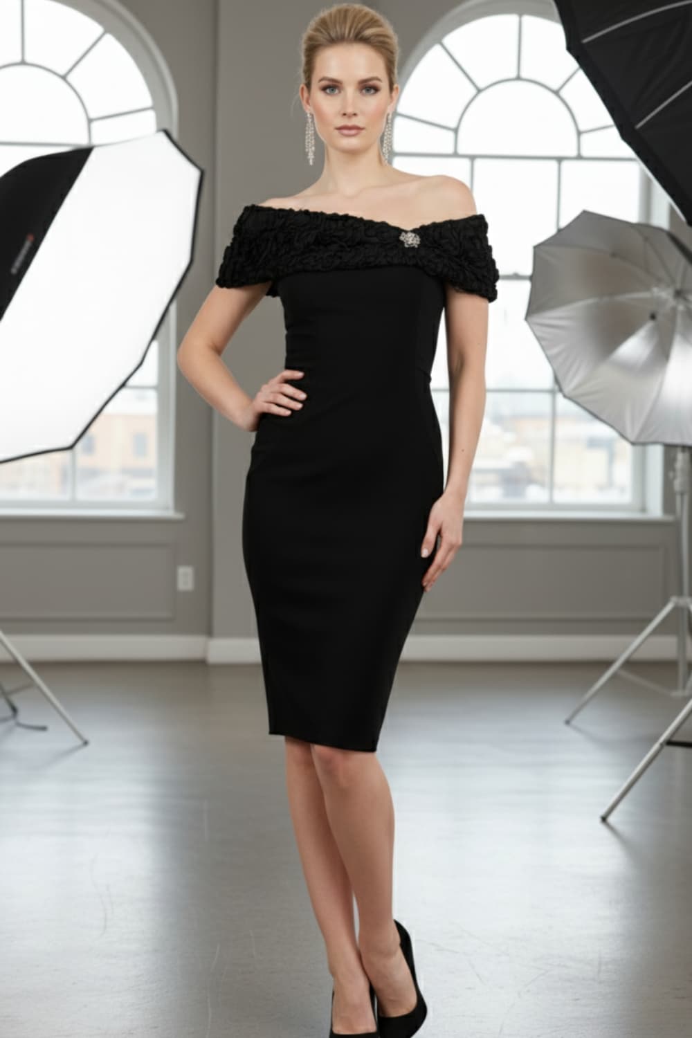 Model wearing the Diva Cornelli Perth dress with cornelli lace top, off shoulder design and diamanté brooch in black and black front image (Black & Black)