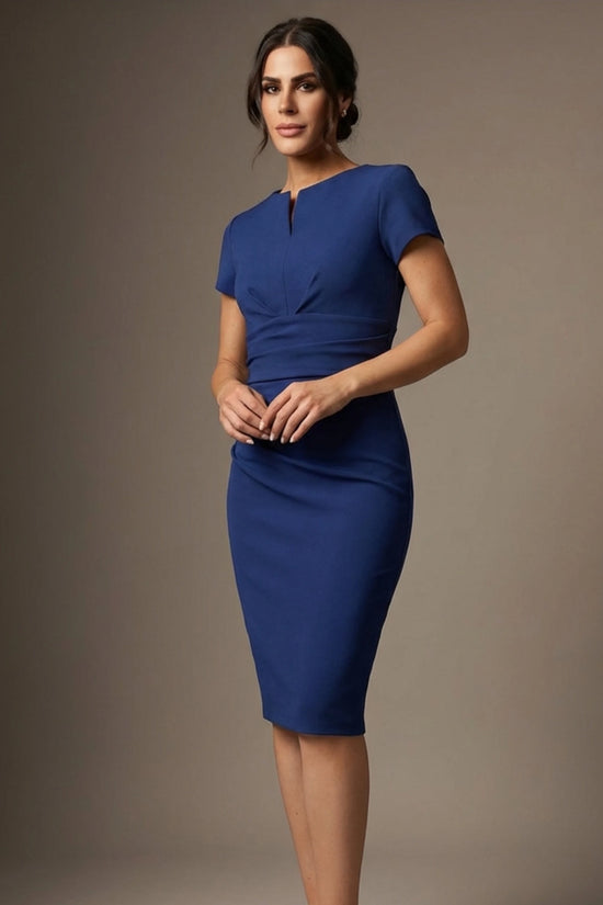 Woman wearing a navy pencil dress for work