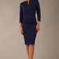 model wearing diva catwalk donna pencil dress with wide band and sleeves and rounded neckline with low split in navy blue colour front