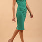 Model wearing Diva Catwalk Donna Short Sleeve Pencil Dress with a wide band and pleating across the tummy area in Emerald Green front side