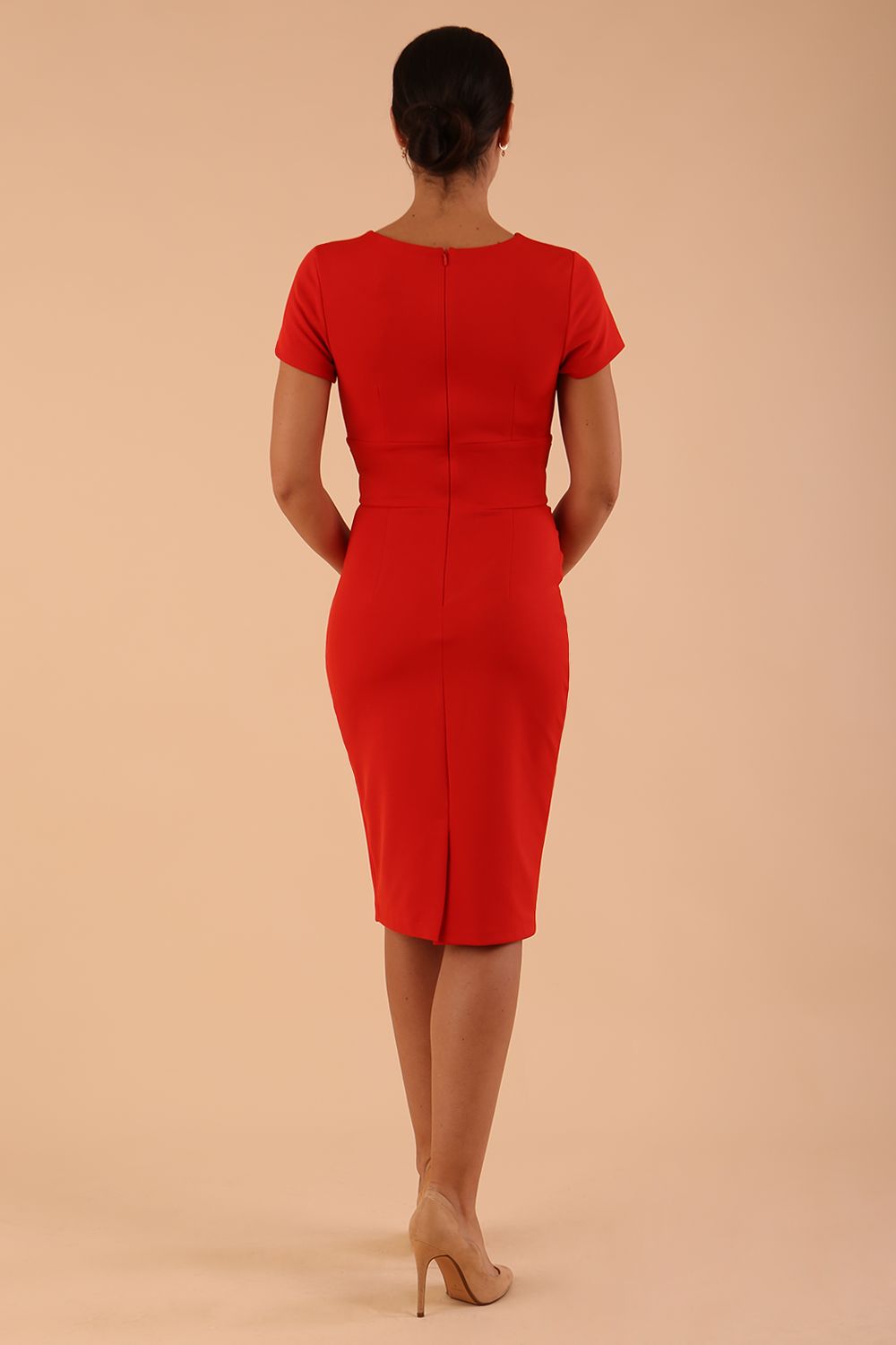 Model wearing Diva Catwalk Donna Short Sleeve Pencil Dress with a wide band and pleating across the tummy area in Burnt Orange back