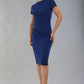 Model wearing Diva Catwalk Donna Short Sleeve Pencil Dress with a wide band and pleating across the tummy area in Navy Blue front