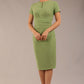 Brunette Model wearing a Diva Catwalk Donna Short Sleeve Pencil Dress with a wide band and pleating across the tummy area and round neckline with v-slit in Aspen Green front image