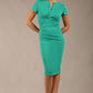 Brunette Model wearing a Diva Catwalk Donna Short Sleeve Pencil Dress with a wide band and pleating across the tummy area and round neckline with v-slit in Emerald Green front image