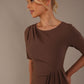 Model wearing the Diva Lynette dress in pencil dress design in peppercorn brown front image close up