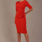 Model wearing the Diva Lynette dress in pencil dress design in fiesta orange front image