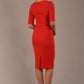 Model wearing the Diva Lynette dress in pencil dress design in fiesta orange front image back view