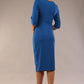 model is wearing a diva catwalk Seed Lexie Pleated Pencil Dress in couture fabric with elbow length sleeves and knee length in sapphire blue colour back