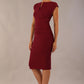 model wearing diva catwalk daphne sleeveless pencil dress with rounded neckline with split in the middle in blissful burgundy side