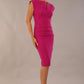 model wearing diva catwalk daphne sleeveless magenta haze pencil dress with rounded neckline with split in the middle in front