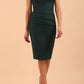 model wearing diva catwalk daphne sleeveless burn orange pencil dress with rounded neckline with split in the middle in front in Forest Green front