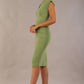 model wearing diva catwalk daphne sleeveless aspen green pencil dress with rounded neckline with split in the middle 