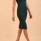 model wearing diva catwalk daphne sleeveless burn orange pencil dress with rounded neckline with split in the middle in front in Forest Green front side