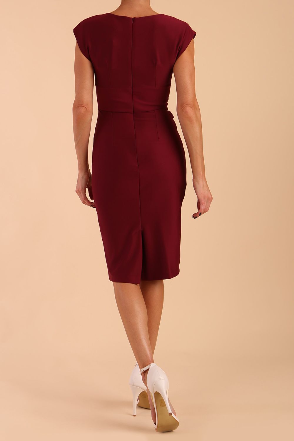 model wearing diva catwalk daphne sleeveless magenta haze pencil dress with rounded neckline with split in the middle in blissful burgundy back