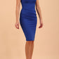 model wearing diva catwalk daphne sleeveless burn orange pencil dress with rounded neckline with split in the middle in front in Cobalt Blue front