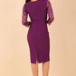 Brunette Model is wearing seed couture lace pencil dress by diva catwalk in imperial purple back