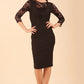 Brunette Model is wearing seed couture lace pencil dress by diva catwalk in black front