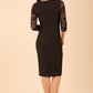 Brunette Model is wearing seed couture lace pencil dress by diva catwalk in black back