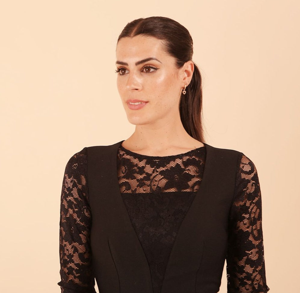 Brunette Model is wearing seed couture lace pencil dress by diva catwalk in black front close up