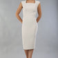 model is wearing diva catwalk seed cadiz pencil sleeveless dress in sandy cream front