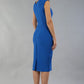 model is wearing diva catwalk seed cadiz pencil sleeveless dress in sapphire blue back