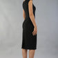 model is wearing diva catwalk seed cadiz pencil sleeveless dress in black back