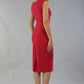 model is wearing diva catwalk seed cadiz pencil sleeveless dress in crimson pink back