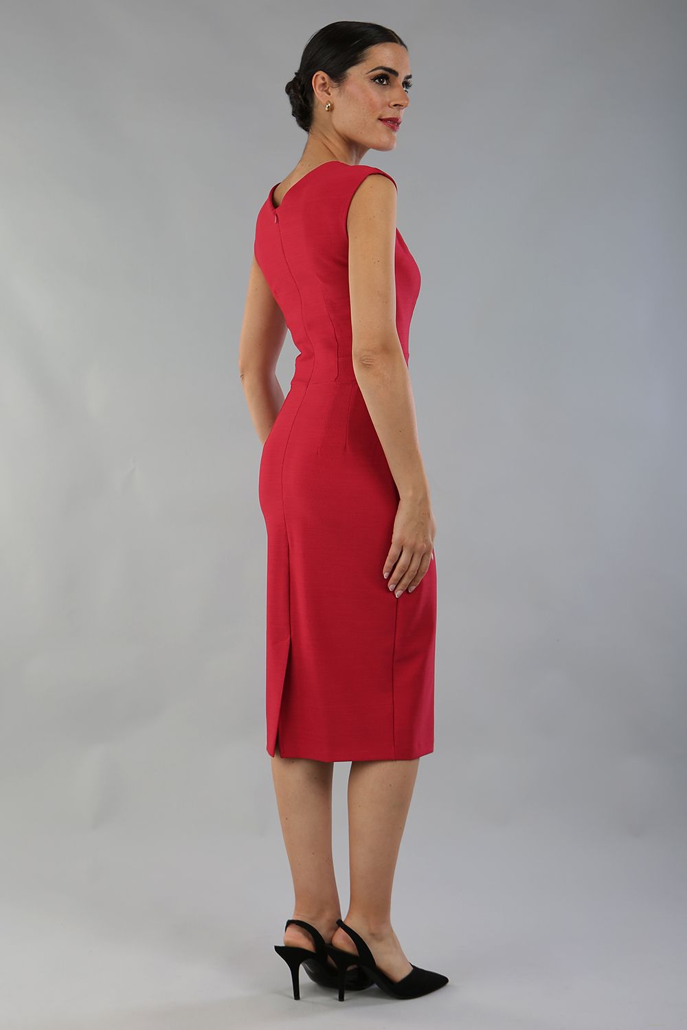 model is wearing diva catwalk seed cadiz pencil sleeveless dress in crimson pink back