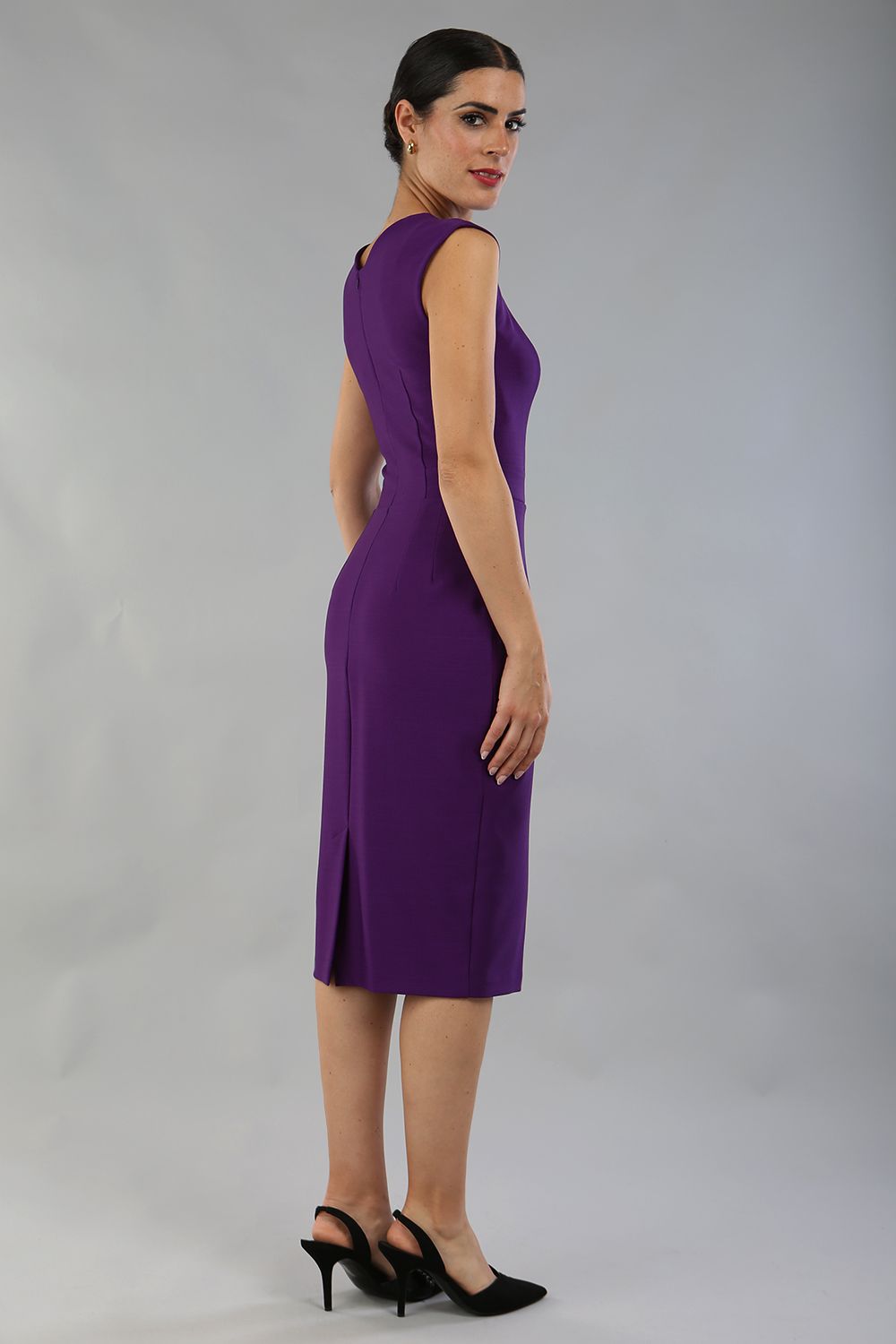 model is wearing diva catwalk seed cadiz pencil sleeveless dress in imperial purple back