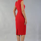 model is wearing diva catwalk seed cadiz pencil sleeveless dress in salsa red front