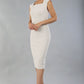 model is wearing diva catwalk seed cadiz pencil sleeveless dress in sandy cream front