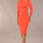 Model wearing Diva catwalk Daphne ¾ Sleeved pencil-skirt dress with pleat detail across the hips and ¾ sleeve length in hot coral front