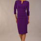 Model wearing the Diva Daphne ¾ Sleeved dress with pleat detail across the hips and ¾ sleeve length in  passion purple front