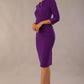 Model wearing the Diva Daphne ¾ Sleeved dress with pleat detail across the hips and ¾ sleeve length in  purple front