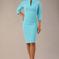 Model wearing the Diva Daphne ¾ Sleeved dress with pleat detail across the hips and ¾ sleeve length in sky blue front image