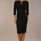 Model wearing the Diva Daphne ¾ Sleeved dress with pleat detail across the hips and ¾ sleeve length in black front