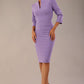 Model wearing the Diva Daphne ¾ Sleeved dress with pleat detail across the hips and ¾ sleeve length in lilac wisteria front image