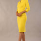 Model wearing Diva catwalk Daphne ¾ Sleeved pencil-skirt dress with pleat detail across the hips and ¾ sleeve length in blazing yellow front