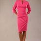 Model wearing the Diva Daphne ¾ Sleeved dress with pleat detail across the hips and ¾ sleeve length in hibiscus pink front