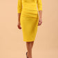 Model wearing Diva catwalk Daphne ¾ Sleeved pencil-skirt dress with pleat detail across the hips and ¾ sleeve length in blazing yellow front