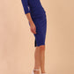 Model wearing the Diva Daphne 3/4 Sleeved dress with pleat detail across the hips and 3/4 sleeve length in Cobalt Blue side